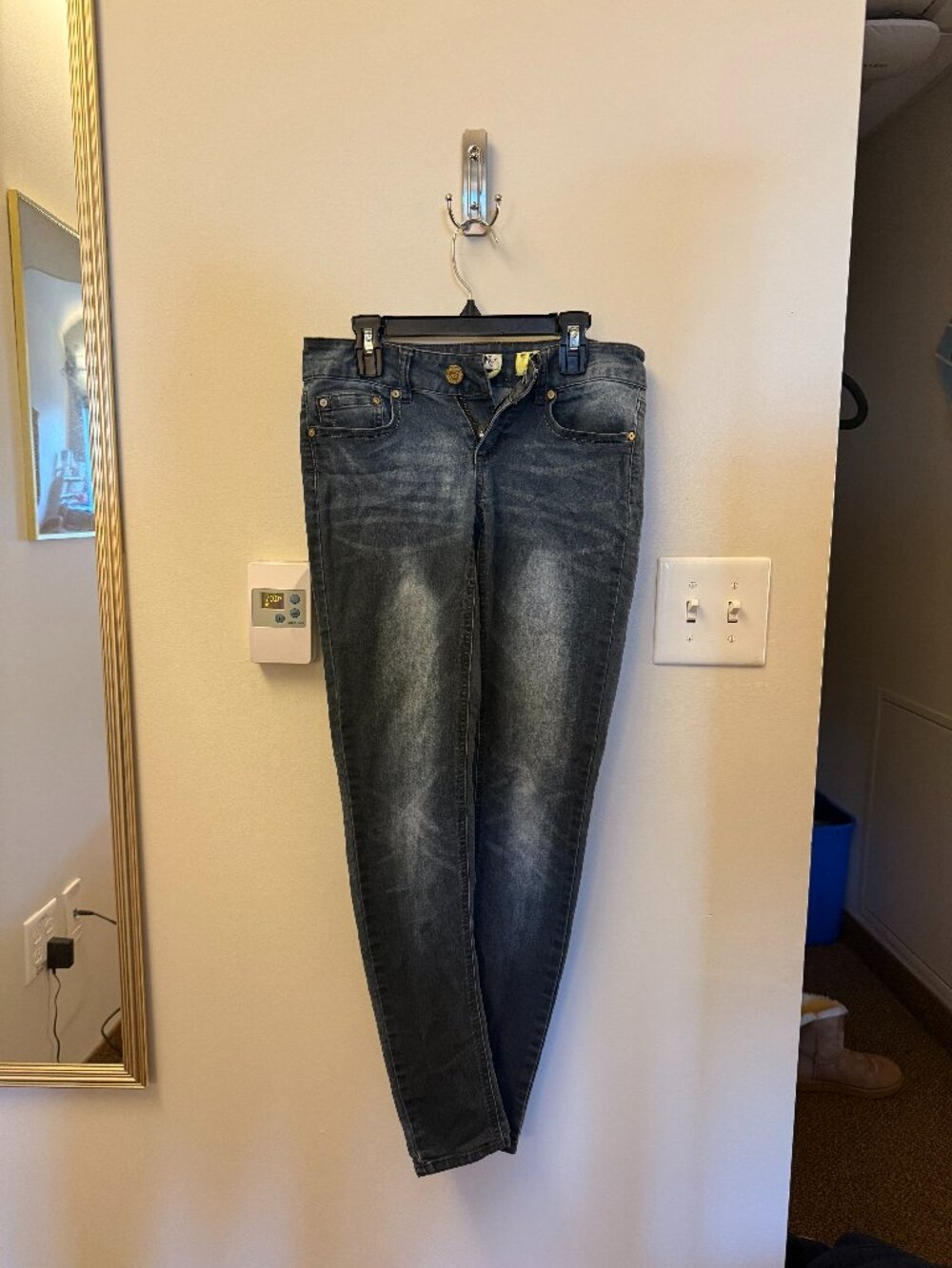 Low rise skinny jeans. Dark wash with lighter areas. some embroidery on the back